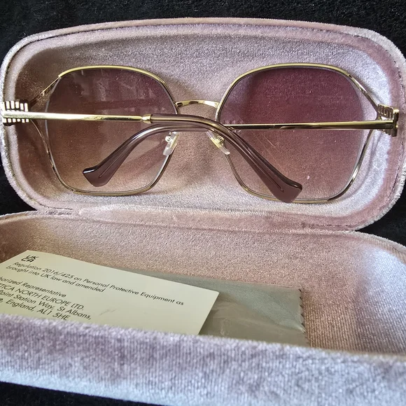 Miu Miu Gold and Pink Glasses with Chic Design